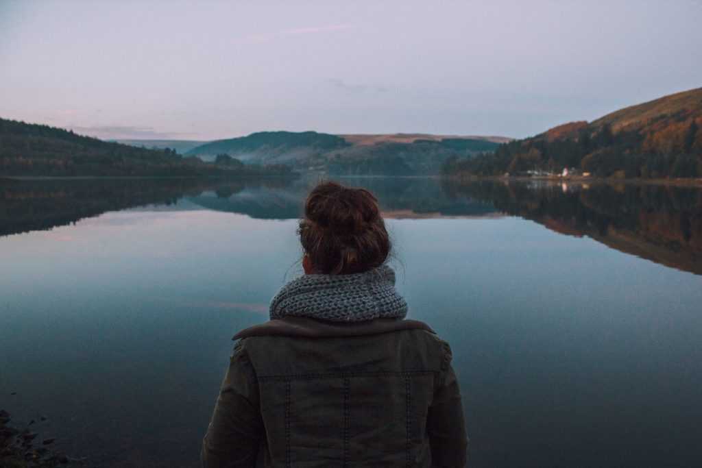 Girl sitting at Loch with Lean Lifestyle design.